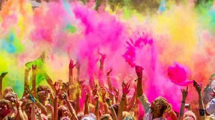 Why is Holi called festival of colours and what do red, pink, blue and green symbolise?